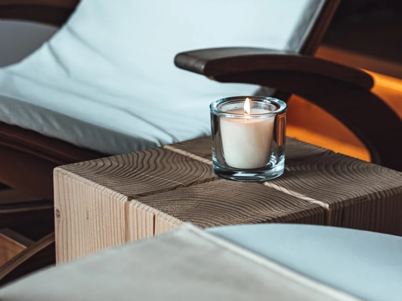 rest room with deck chairs and candle